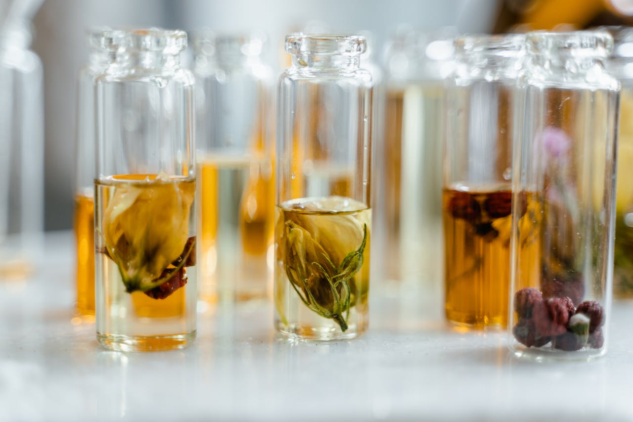 Glass bottles with floral infusions perfect for natural aromatherapy and skincare.